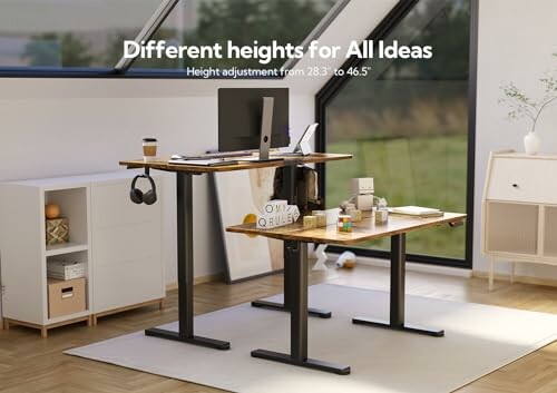 Modern office with adjustable standing desk in different heights.