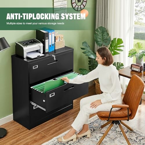 Woman organizing files in black filing cabinet with anti-tip locking system.