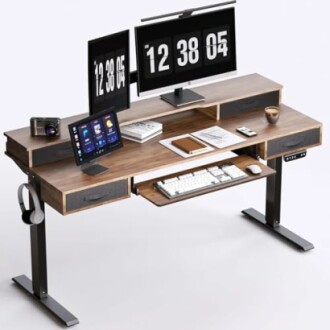 Modern standing desk with monitors, keyboard, and tablet.